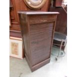 An early 20th century oak tamber fronted cabinet (No Key)