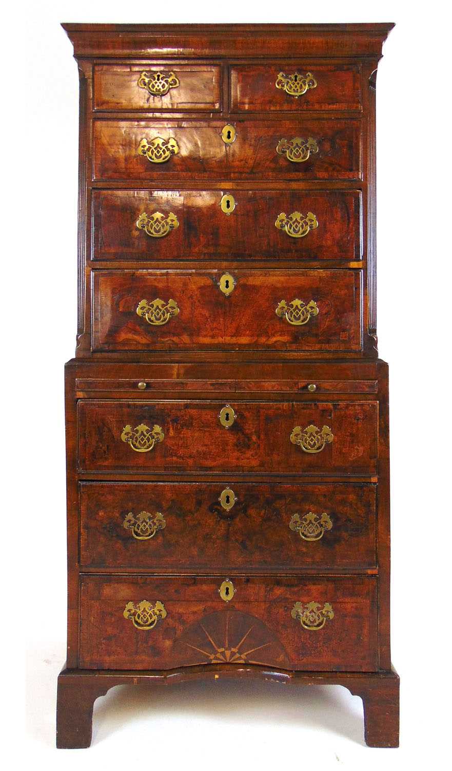 An early 18th century and later walnut chest on chest, the cavetto cornice over two short and