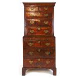 An early 18th century and later walnut chest on chest, the cavetto cornice over two short and