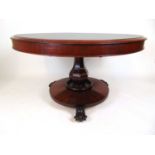 An early Victorian mahogany breakfast table, the circular book matched veneered tilt top over the