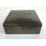 A small silver cigar box of conventional form. Hallmarked for Birmingham 1921 (possibly), l. 8 cm