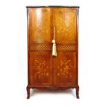 A 19th century style French kingwood and floral marquetry drinks cabinet. Two serpentine fronted