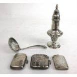 A selection of silver items to include a Victorian pepper pot, a sifting spoon, two silver vesta