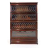 An early 20th century walnut 'Globe Wernicke' four section bookcase with leaded glass doors, h.