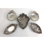 A pair of Victorian silver pierced bon-bon dishes together with a pair of scallop butter dishes