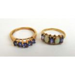 A 9ct gold opal and purple stone dress ring together with one other yellow metal ring marked '