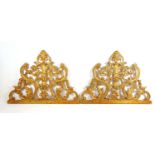 A pair of 19th century baroque giltwood door tops, h. 80 cm, w. 109 cmBreaks and repairs in areas.