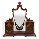 An Edwardian mahogany and painted toilet mirror, the shield plate surrounded by floral and swag