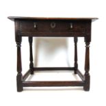 An 18th century oak side/child's table, the moulded top over a single drawer on turned legs, h. 65