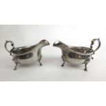 A pair of George V silver sauce boats of conventional form. Hallmarked for London 1925 & 1929,