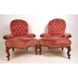 A pair of Victorian walnut nursing chairs upholstered in a pink button back fabric, the serpentine