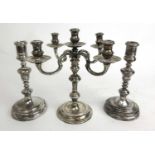 An Elizabeth II silver four branch candelabra together with a pair of George V silver