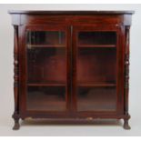 A Regency and later rosewood and boxwood strung bookcase, the later top over two glazed doors
