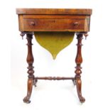 A Victorian rosewood games/work table, the fold over top with inlaid chess and backgammon board over