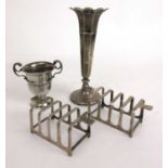 A selection of silver items to include a pair of toast racks, vase and a small trophy. Various