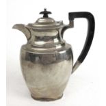 A George V silver hot water jug. Hallmarked for Sheffield 1928, makers mark for Atkin Brothers.