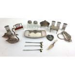 A collection of miniature silver and white metal items to include miniature furniture, swans, enamel