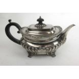 An Edwardian silver teapot with part reeded body and bracket feet. Hallmarked for London 1904.