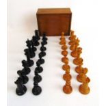 An early 20th century Jacques Staunton style boxwood and ebony chess set, several pieces bearing a