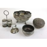 A collection of silver and eastern white metal items to include bowl, pot, cruet, menu holder etc.