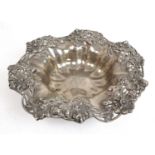 A large white metal embossed and pierced fruit bowl marked 'Sterling'. Approx weight 880g, dia. 33