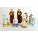 A collection of Royal Worcester candle snuffers to include monks, nun, Punch, Baby etc.