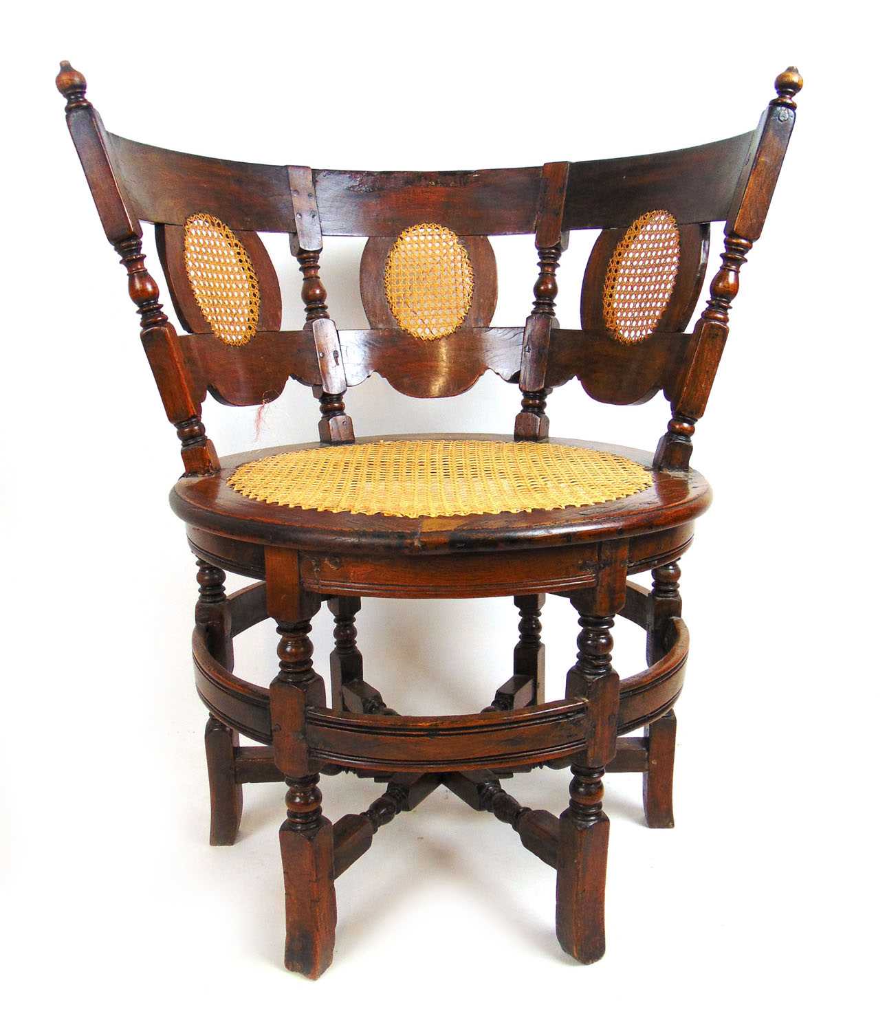 An 18th century probably Dutch Burgomeister chair with caned back panels, caned seat and red