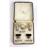 A cased George V five piece silver cruet set by Asprey. Hallmarked for London 1925, makers mark