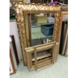 An ornate gilt wood foliate picture frame along with three others