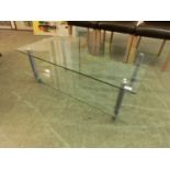 A modern glass two tiered coffee table