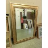 A gilt framed bevel glass mirror