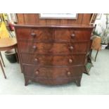 An early 19th century flame mahogany bow front chest of two short over three long drawers