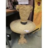 A resin moulded table with horse and cart design along with a moulded oriental style vase