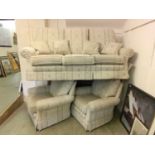 A three piece suite comprising of three seat sofa and two armchairs upholstered in a floral