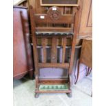 A 19th century oak snooker cue holder with paw feet