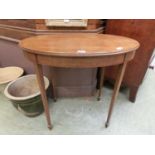 An Edwardian mahogany satinwood banded oval occasional table