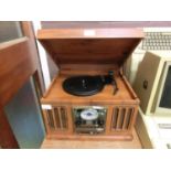 A vintage style stereo system comprising of turntable, CD and tape player, radio, etc