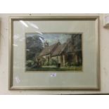 A framed and gazed possible watercolour of church scene
