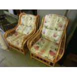 A pair of bamboo conservatory chairs