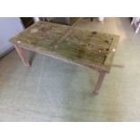 A weathered teak garden table