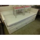An Ikea daybed, drawers to base pulling out to provide double bed