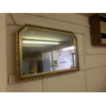 An ornate gilt framed mirror