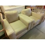A pair of armchairs upholstered in cream leather from John Lewis