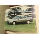 Five large photographic prints of cars to include Honda