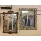Ornate gilt framed mirror with one other