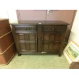 Reproduction oak sideboard, top over 2 drawer and two 4 panelled doors
