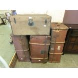 4 wooden and oilskin bound travelling trunks