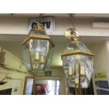 A pair of modern brass and glass ceiling lanternsBoth lanterns are wired. Dimensions: H: 40cmW:
