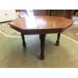 A mid-20th century eight-sided walnut occasional table