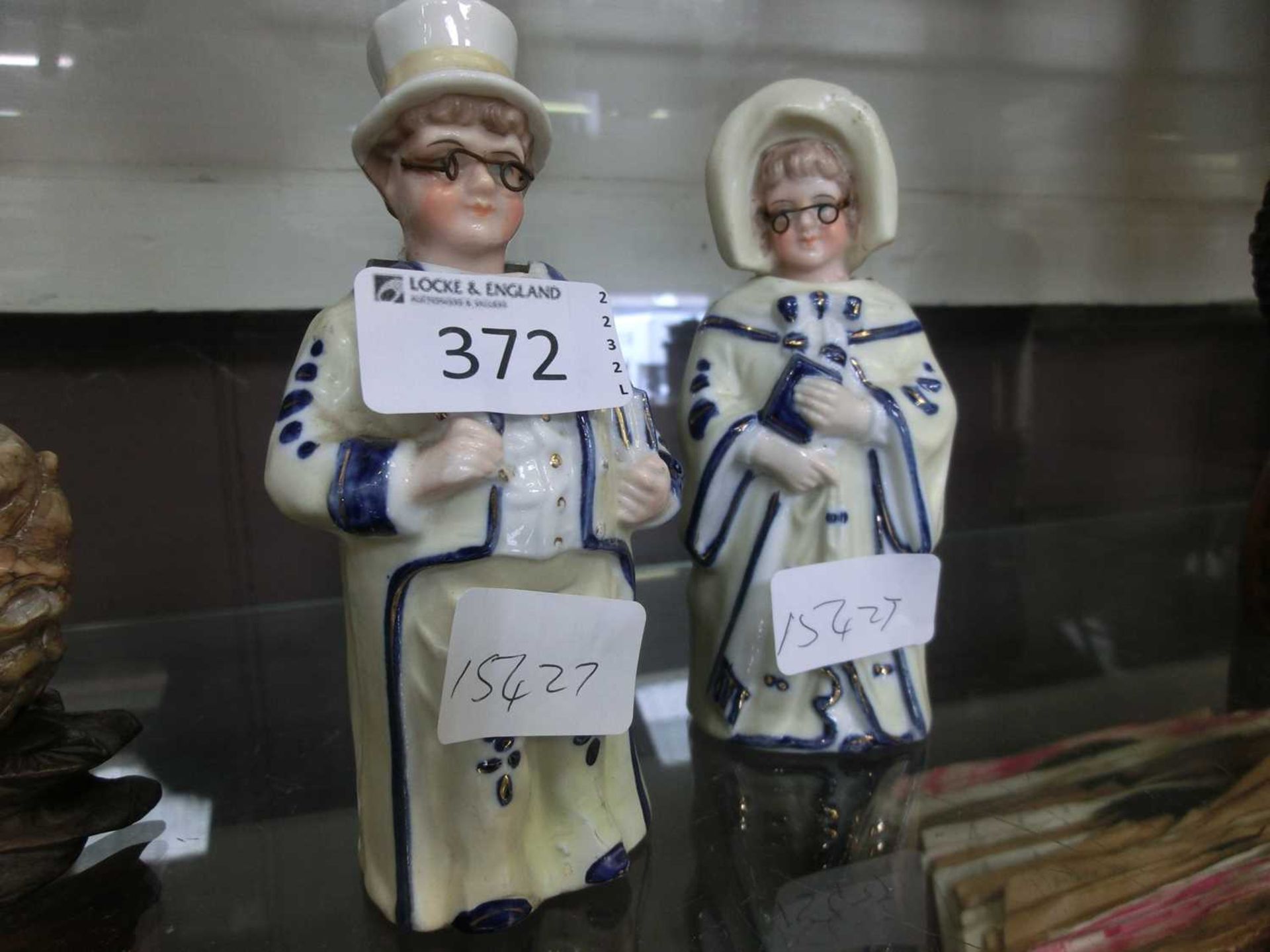 Pair of ceramic figurines of lady and gentleman with nodding heads